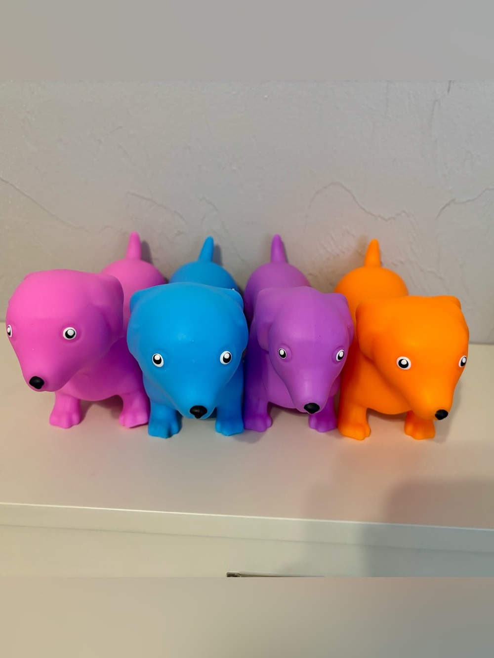 Squeeezy Dogs Squishy Toys Bundle - Pink, Purple, Blue & Orange